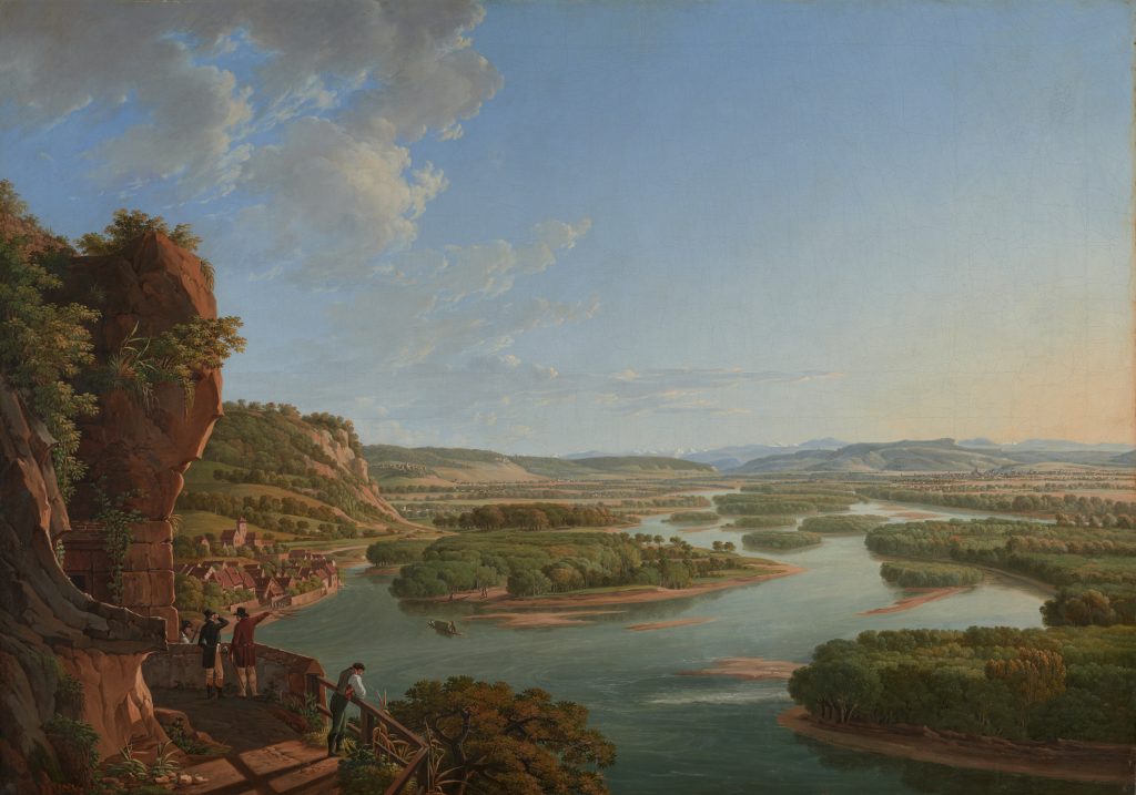 Das Gemälde von Peter Birmann zeigt von einem Aufsichtspunkt am Isteinerklotz den Blick auf den Rhein bei Basel. Der Rhein schlängelt sich durch die Landschaft und besteht aus vielen Inseln.
